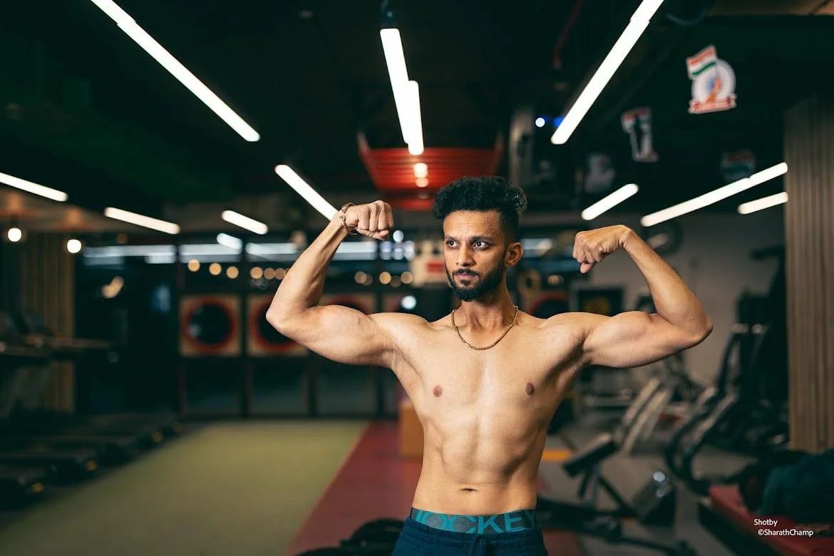 Coach Sai Teja flexing in the gym